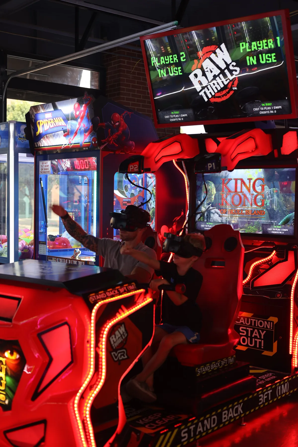 A player on one of the motion racing machines