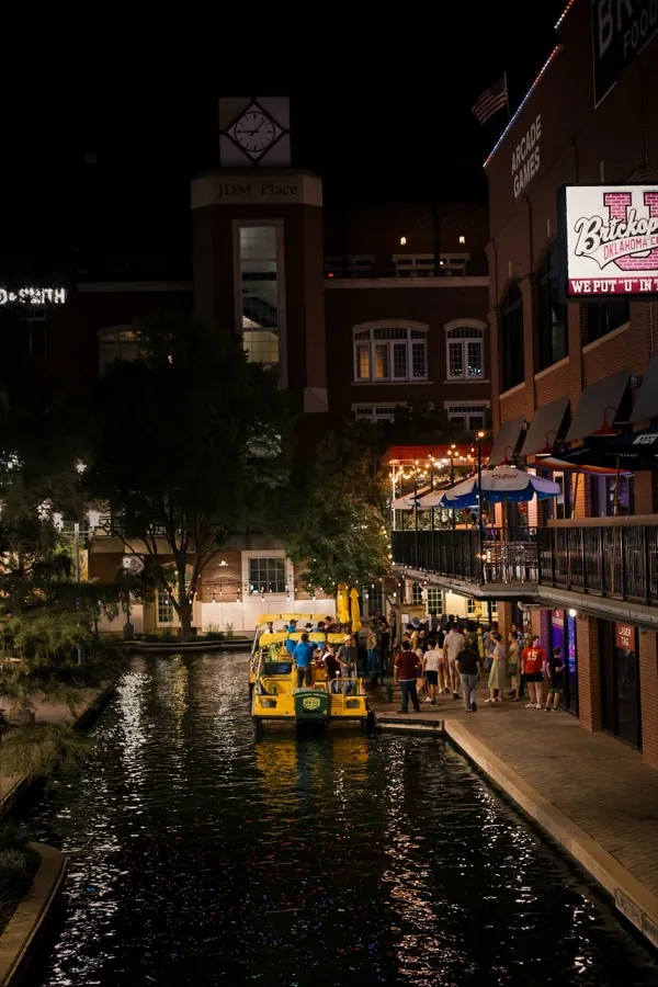 Brickopolis on the Bricktown canal at night, the water taxi pulled up at the dock