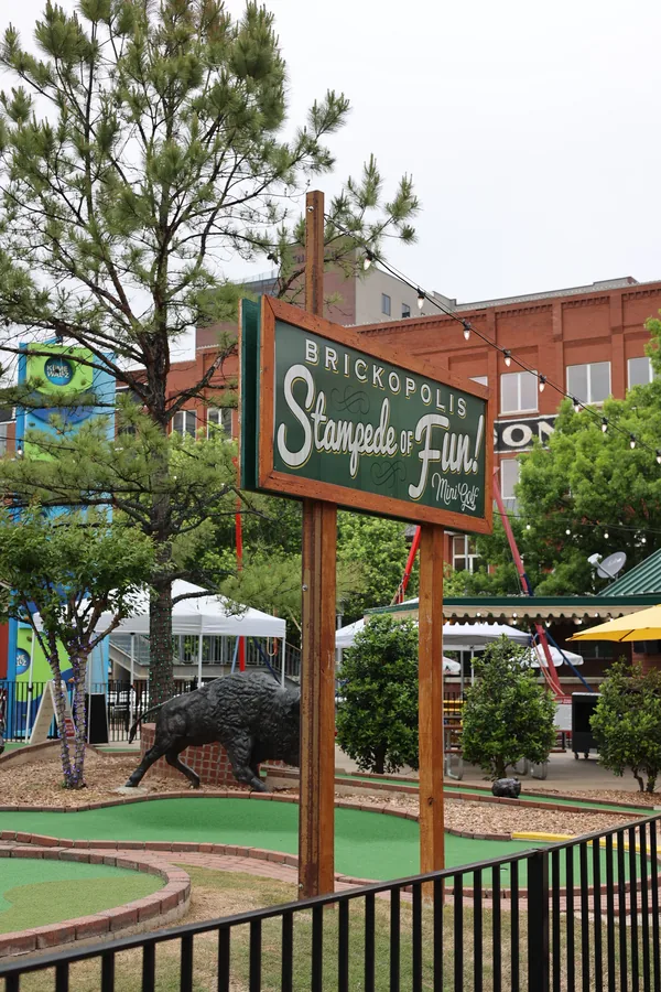 The Brickopolis Stampede of Fun sign over the mini golf course