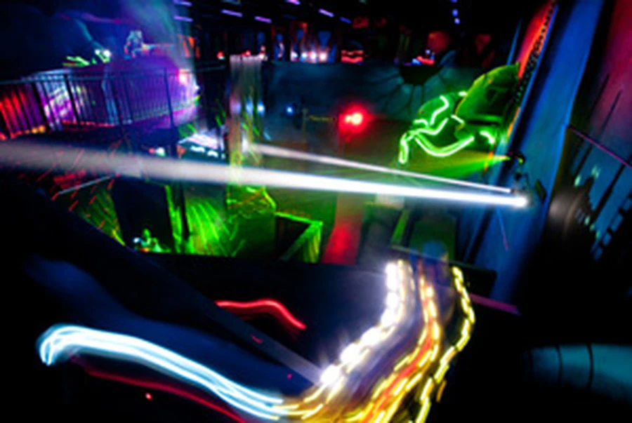 Light trails across the two-story laser tag arena
